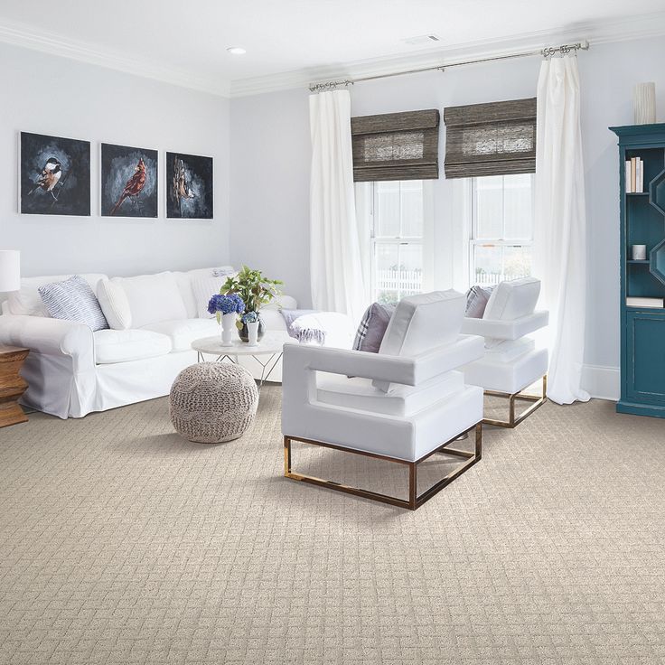 An image of a living area with carpet flooring